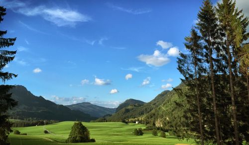 Scenic view of mountains against cloudy sky