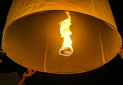 Low angle view of illuminated light bulb