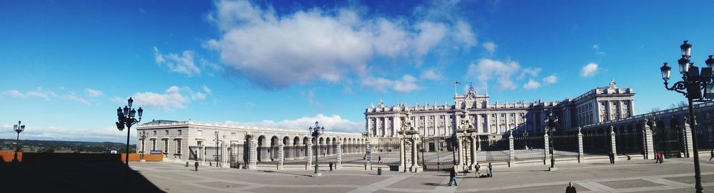 View of buildings against blue sky and clouds