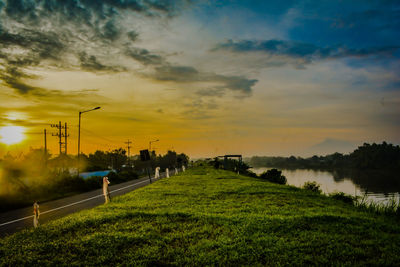 Scenic view of field against sky during sunset