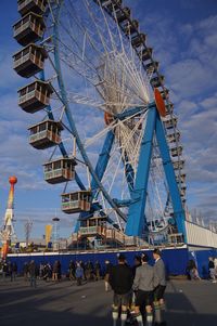 Low angle view of ferris wheel against sky