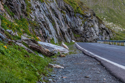 Empty road amidst rocks