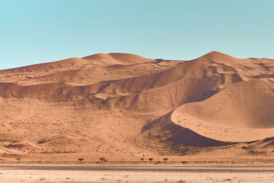 Scenic view of desert against clear sky