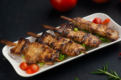 High angle view of meat on barbecue grill