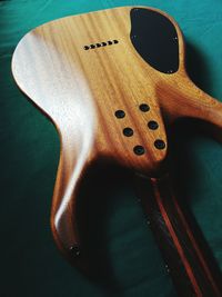 High angle view of guitar on table