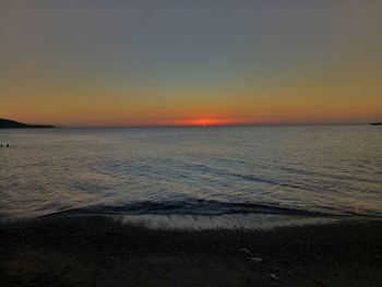 Scenic view of sea against clear sky during sunset