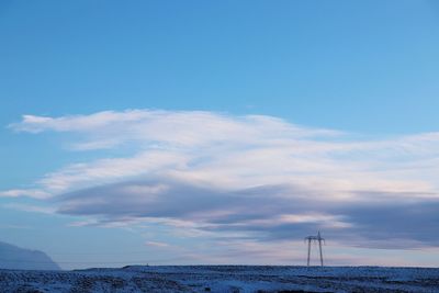 Scenic view of sea against blue sky
