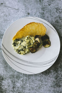 Plate of polenta with chard and parmiggiano