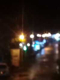 Defocused image of illuminated street lights at night