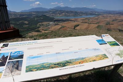 High angle view of information sign on field