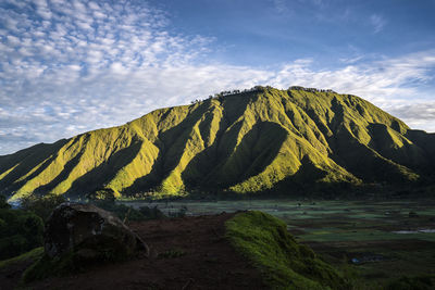 Scenic view of land against sky