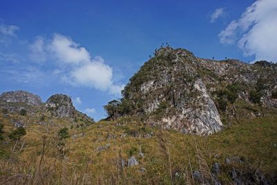 Low angle view of rocks against sky