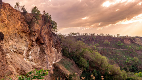 Rock formations on landscape against sky