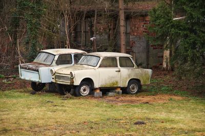 Abandoned car on field