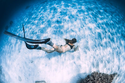 Full length of woman swimming in sea