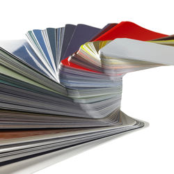 Close-up of books on table against white background