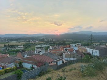 View of cityscape at sunset
