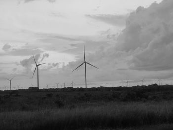 Wind turbines on field