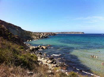 Scenic view of sea against blue sky