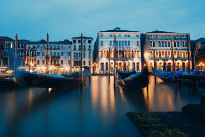 Boats moored in canal