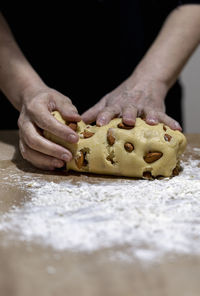 Close-up of person preparing food on table