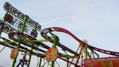 Low angle view of ferris wheel against sky