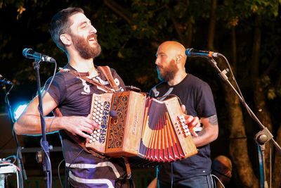 Friends playing on stage