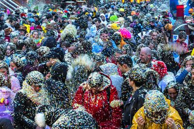 High angle view of people playing with confetti during event