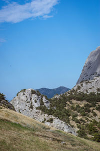 Scenic view of mountains against clear blue sky