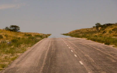 Road amidst landscape against clear sky