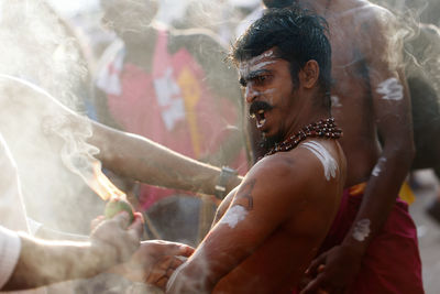 Close-up of young woman in water