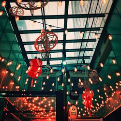 Low angle view of illuminated lanterns hanging on ceiling