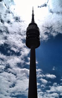 Low angle view of tower against cloudy sky