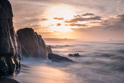 Scenic view of sea against sky during sunset