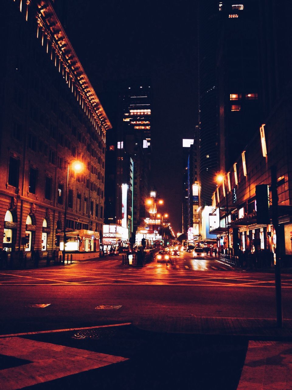 illuminated, night, building exterior, architecture, built structure, street, city, transportation, street light, road, lighting equipment, the way forward, city street, city life, road marking, light - natural phenomenon, outdoors, diminishing perspective, light trail, building