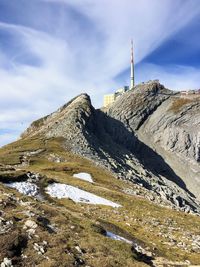 Low angle view of snowcapped mountain against sky