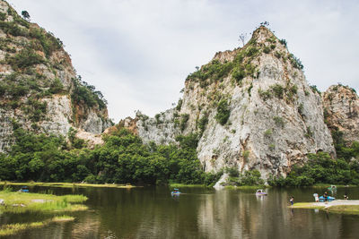 Scenic view of rocks and mountains against sky