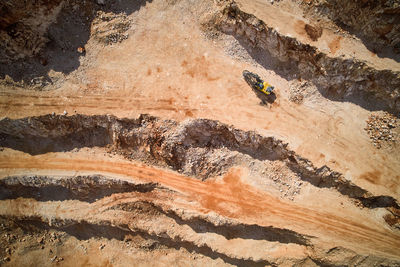 Ledges of a quarry after blasting and drilling operations. aerial view of open-pit mine