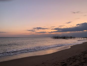 Scenic view of beach against sky during sunset