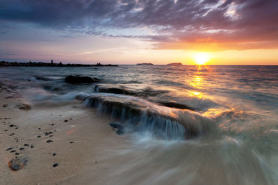 Scenic view of sea against sky during sunset