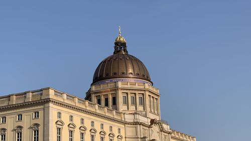 Low angle view of berlin castle against clear blue sky