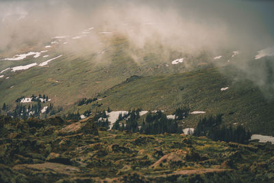 Snow capped mountains, rocky mountains, rocks.