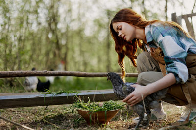 Side view of young woman looking away