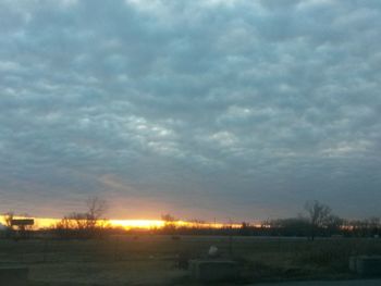 Scenic view of field against sky during winter