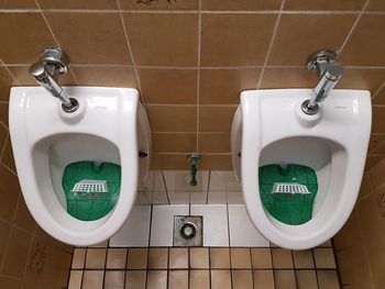 High angle view of urinals in bathroom