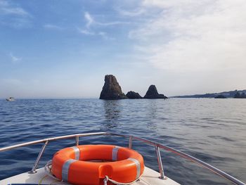 Boat sailing in sea against sky