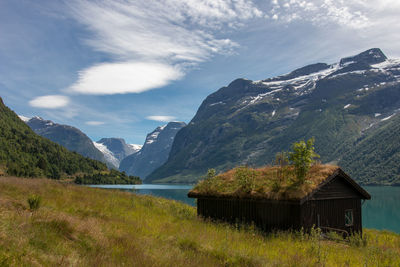 Scenic view of lake and mountains against sky