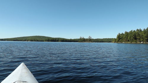 Boat in sea against clear sky