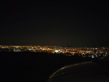 Illuminated cityscape at night