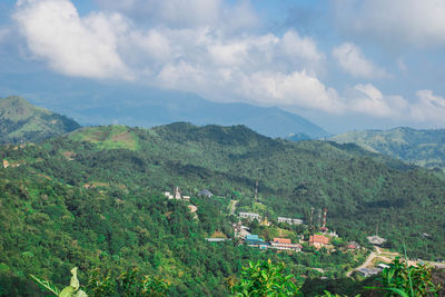 High angle view of trees and mountains against sky